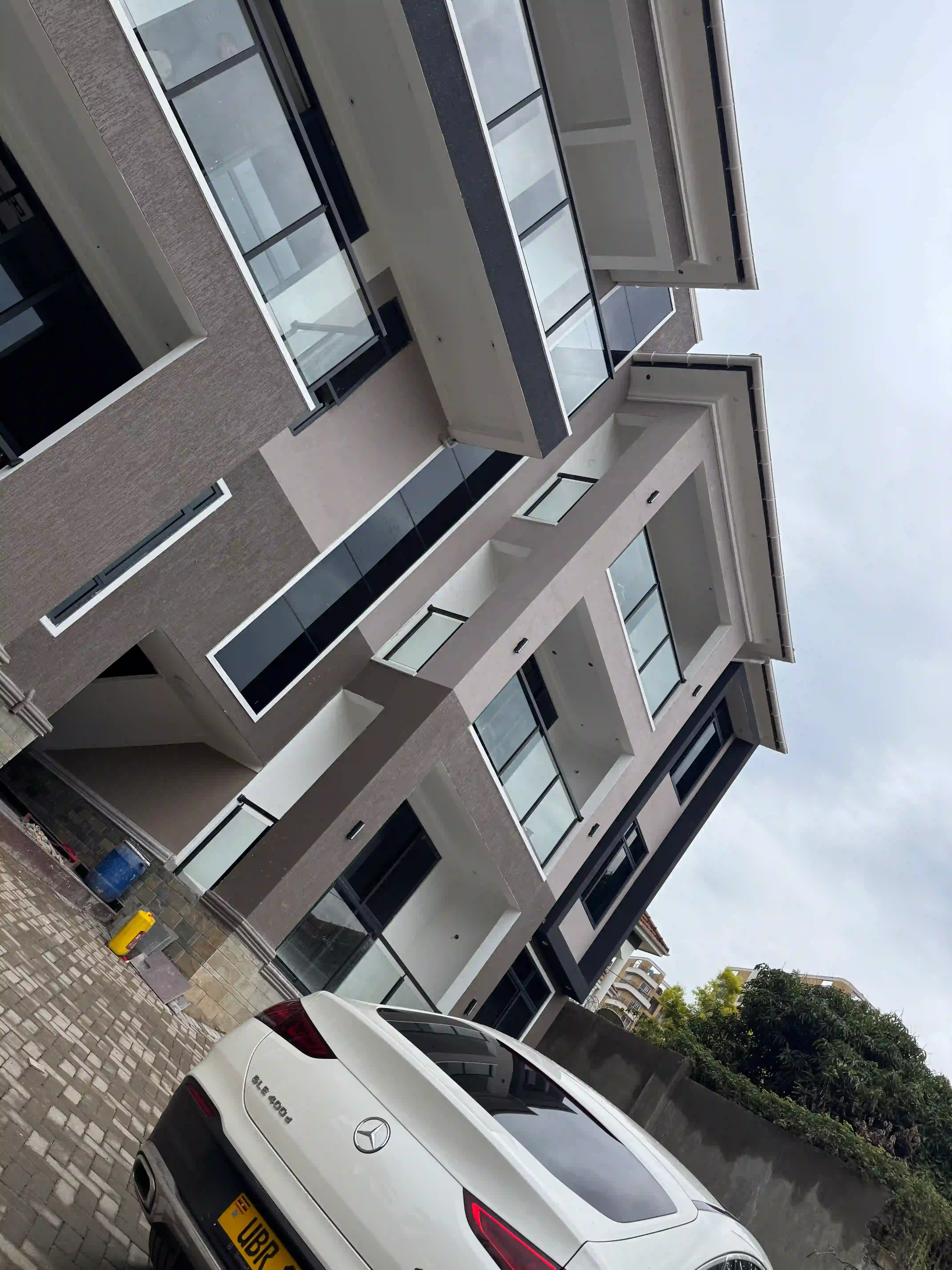 A completed Kayo Properties development in Kampala, at dusk